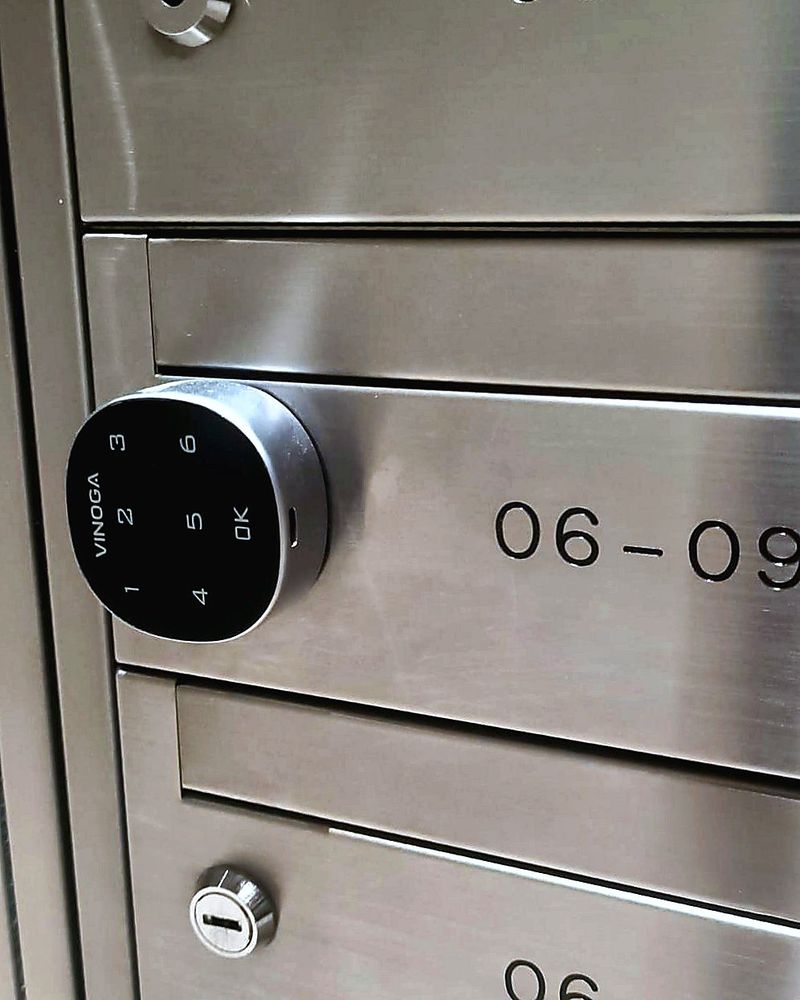 Digital keypad lock fitted to a stainless steel condo letterbox