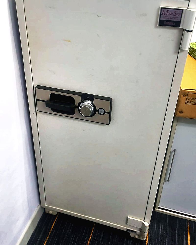 Tall office safe cabinet with keypad lock in a Singapore office